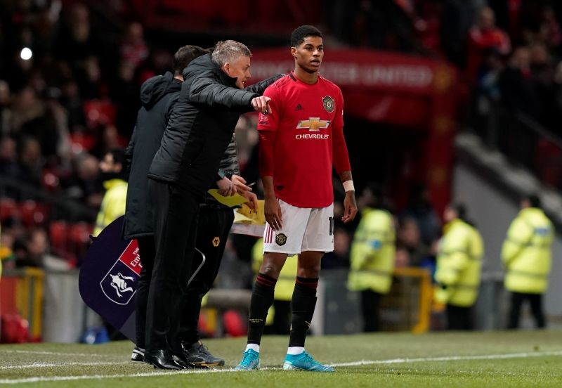 FILE PHOTO: Soccer Football - FA Cup Third Round Replay - Manchester United v Wolverhampton Wanderers - Old Trafford, Manchester, Britain - January 15, 2020 Manchester United manager Ole Gunnar Solskjaer talks to Marcus Rashford as he prepares to come on REUTERS/Andrew Yates